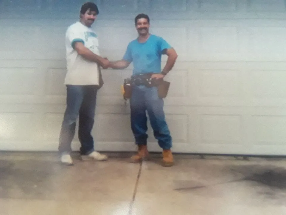 Owner Peter Loukas with a customer in 1991